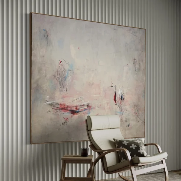 Large scale original PEZ artwork styled on a minimalist living room wall above a modern white accent chair and round stone coffee table for luxury interior inspiration.